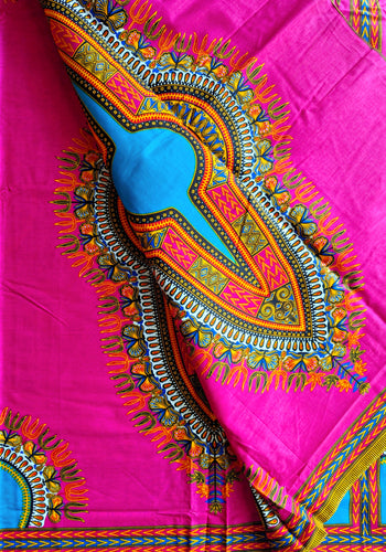 Colorful African fabric with intricate patterns on a pink background