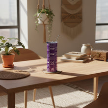 Purple tumbler with geometric pattern and metal straw on a white background