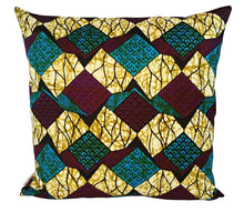 A square throw pillow featuring a vibrant African wax print pattern with repeating diamond shapes in teal, gold, burgundy, and black on a white background.