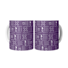 two ceramic coffee mugs with purple and white african pattern sitting side by side