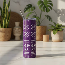 Purple tumbler with white geometric pattern and metal straw on a white background