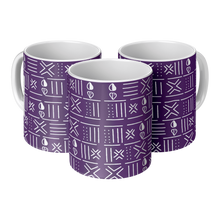 three ceramic coffee mugs with purple and white african patterns sitting side by side