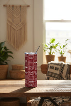 Tumbler with geometric pattern and metal straw on a white background