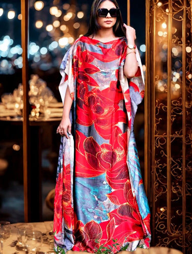 Woman wearing a red floral dress in an elegant indoor setting