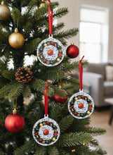 Decorative Christmas ornaments on a tree with red ribbons