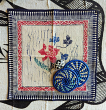 Decorative floral design dinner napkin with and blue floral pattern, drink coasters and napkin ring.  