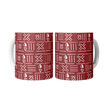 two red white cowrie shell tribal pattern coffee mugs displayed side by side