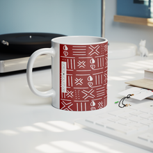red_white_cowrie shell African pattern coffee mug styled next to record player