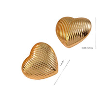 Gold heart-shaped earrings with measurements on a white background