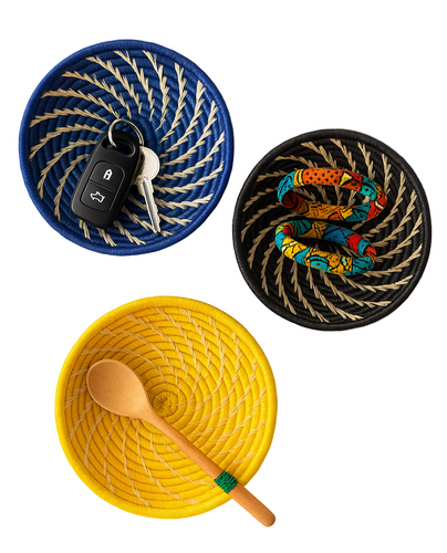 Three woven baskets in blue, yellow, and black with decorative patterns on a white background.