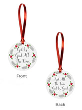 Round Christmas ornament with red ribbon and 'God is Good All the Time' text on a white background.