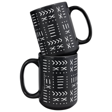 two ceramic coffee mugs with a black and white African pattern coffee mug.