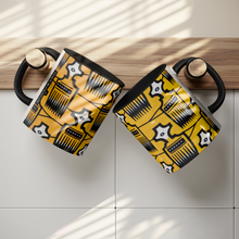 two african pattern coffee mugs with combs design hung on hooks
