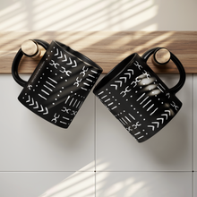 black white african pattern coffee mugs hung on hooks