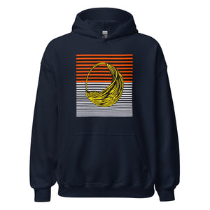 A person wearing a navy blue hoodie with an African pattern, smiling and raising their hands with hoodie over their head.