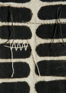 Close-up of a woven fabric with black and white pattern