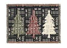 Woven blanket with geometric patterns on a black background