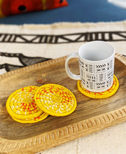 Ensemble de sous-verres tissés jaunes + cuillère en bois de perles orange