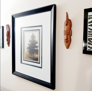 brown wood african masks male faces masculine hanged on the wall