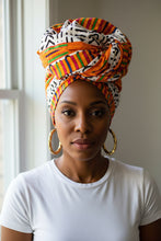 Woman wearing a colorful headscarf indoors