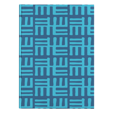 Blue hard cover journal with lined pages and an African inspired pattern