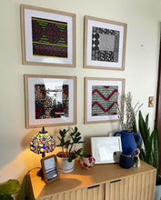gallery wall with framed african fabrics