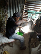 man making soapstone art kenya incense holder
